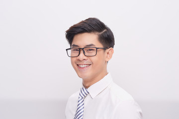 Handsome young asian business man smiling