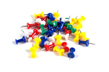 Mark pin pile on the white background in office, tacks