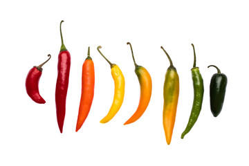 A variety of organic chilies in a row