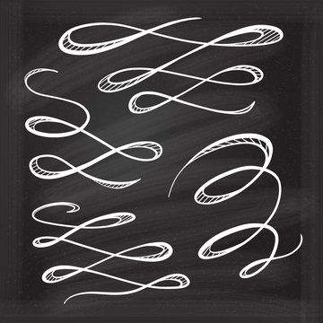 Chalk decorative curls and swirls design elements on the blackboard