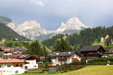 Fototapeta na wymiar Villages in Dolomites mountain regions with Dolomites peaks, South Tirol, Italy