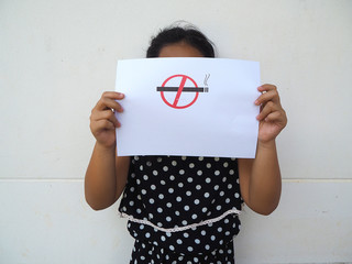 Girl hold NO SMOKING sign print on paper