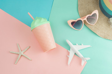 Women's accessories items on pastel colors background, Summer vacation concept