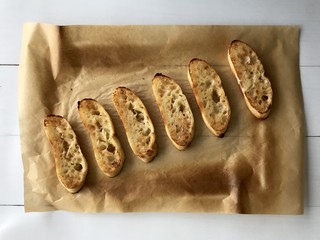 Toasted turkish bread on brown baking paper
