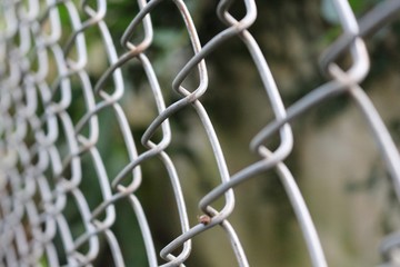Fototapeta premium close up and blurry selective focus of monochrome photo of stainless steel net door . reflective surface