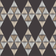Seamless abstract geometric pattern. The texture of the triangles. Embroidery on fabric. Brushwork. Hand hatching. Scribble texture. Textile rapport.