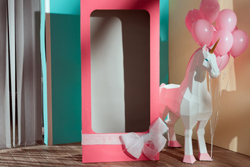 empty pink decorative box with bow and unicorn with pink balloons
