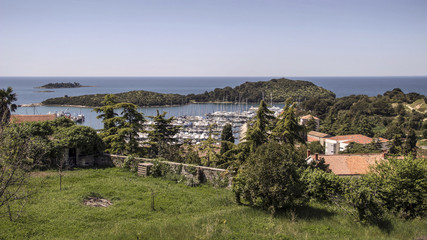 Fototapeta na wymiar Vrsar, Istria, Croatia - A view of the marina and the surrounding islets