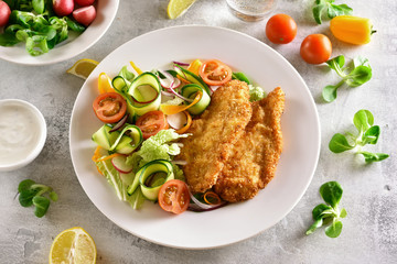 Vegetable salad and schnitzel