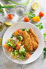 Vegetable salad and schnitzel