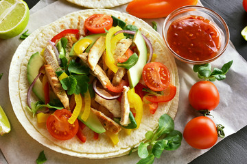 Taco with chicken meat and vegetables