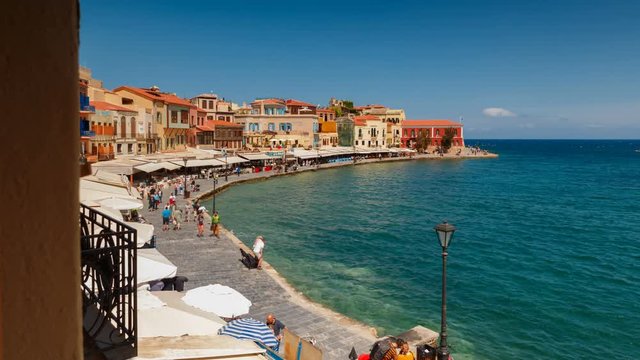Spectacular daytime hyperlapse view of the Old Town promenade in Chania, Crete, Greece featuring the Venetian port and lighthouse