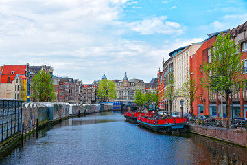 Obraz premium Water boats and canal of Amstel River Amsterdam