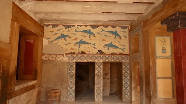 Close-up shot of a room painted with frescoes in the Minoan Palace of Knossos, Heraklion, Crete, Greece. Knossos is the largest Bronze Age archaeological site in Crete and Europe's oldest city.