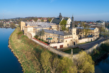 Krakow, Poland. Salwator district with Norbertine nunnery, church, Vistula and Rudawa rivers and far view of Kosciuszko Mound. Aerial photo in sunrise light