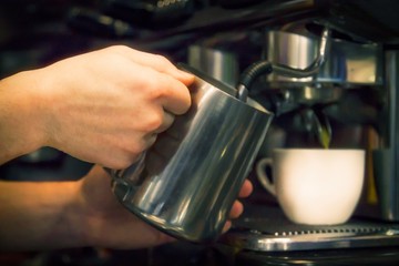 waiter preparing coffee at the restaurant