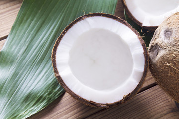 Obraz na płótnie Canvas piece of coconut with wooden background