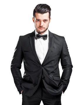 portrait of confident handsome man in black suit with bowtie
