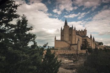 Fototapeta na wymiar Alcazar castle in Segovia with Peñalara mountain. Castilla y Leon, Spain