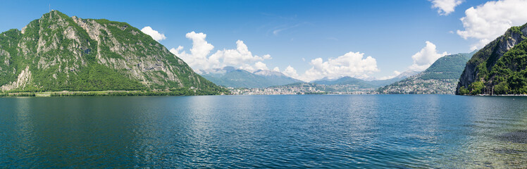 Fototapeta na wymiar Lake Lugano, Switzerland. Panoramic view of the city of Lugano with, on the left, Mount San Salvatore, and on the right, Mount Bre. Panorama from Campione d'Italia