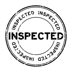 Grunge black inspected word round rubber seal stamp on white background