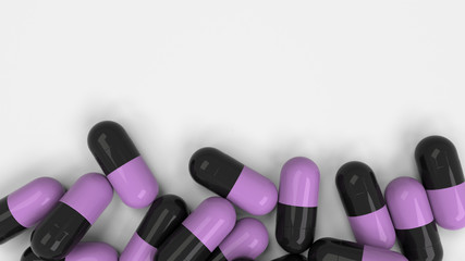 Pile of black and purple medicine capsules