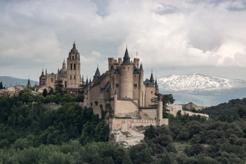 Fototapeta na wymiar Alcazar castle in Segovia with Peñalara mountain. Castilla y Leon, Spain