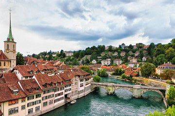 Fototapeta na wymiar Nydegg Church with Unterbrucke bridge over the Aare River Bern