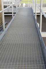 Walking metal rail with railing.