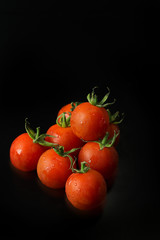 close up fresh tomato on black table  background.