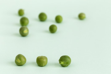  Close up peas on colorful table