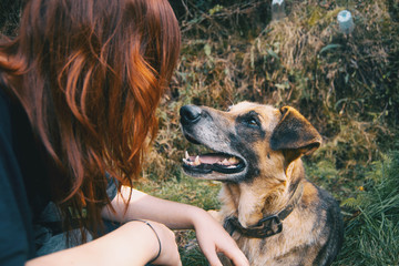 look between friends, a redhead girl and her dog