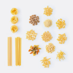 Italian cuisine. Set of assorted types of pasta: spaghetti, macaroni, cannelloni, fettuccine, fusilli, farfalle, tagliatelle and other, different colors. Collection pasta isolated on white background