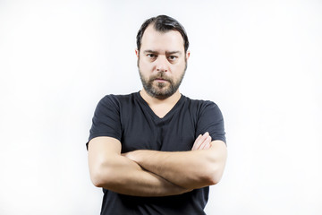 Adult man crossed arms and is looking to the camera