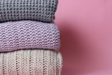 perfect stack of clothes on a colored background. minimalism