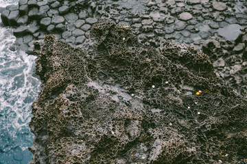 Volcanic Rock Shore at Jusangjeolli. Jeju Island, South Korea. The Jusangjeolli (columnar jointing) cliff is a spectacular volcanic rock formation at the southern coast of Jeju Island.