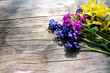 Different kinds of colorful flowers on rustic wooden background. Top view and border design, flower of spring or summer background.Empty space for your text.