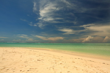 Amazing tropical landscape view. White sand beach , turquoise water and blue sky with white clouds. Horizon line. Maldives, Indian Ocean