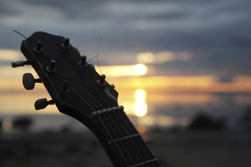 guitar at sunset on the river