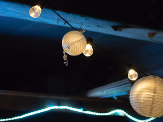 Paper lights strung up for a party at night
