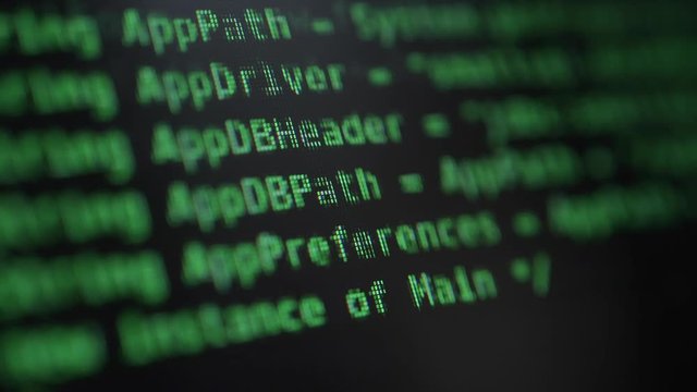 Hacking Concept. Green Running Commands on the Computer Screen