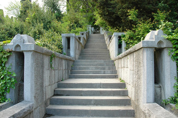 Long stone staircase leading to the distance in the old Park