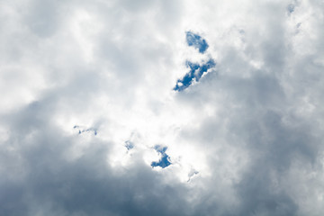 Fluffy white clouds on blue sky horizon. Cumulus landscape background.