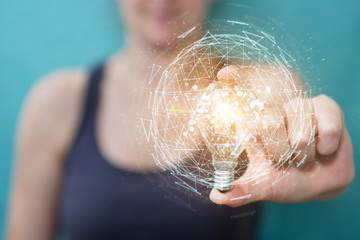 Obraz na płótnie Canvas Businesswoman holding a lighbulb with connections in her hand 3D rendering