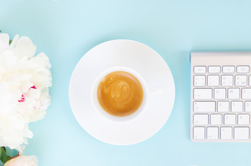 Flat lay home office workspace on blue