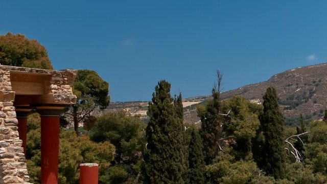 Close-up shot of the northern entrance to the Minoan Palace of Knossos in Heraklion, Crete, Greece and surrounding mountains. 