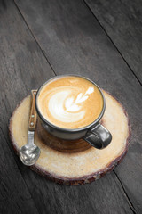 Latte art coffee on table.