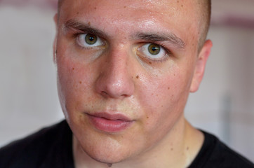 Sweaty red-faced young man after a workout