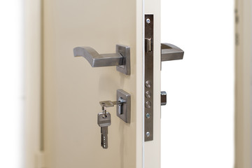 Open armored door. Door lock, metal door. Modern interior design, door handle. New house concept. Real estate.