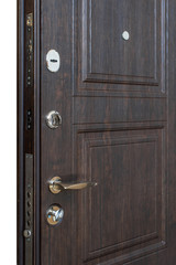 Open door. Door lock, Dark brown door closeup. Modern interior design, door handle. New house concept. Real estate.